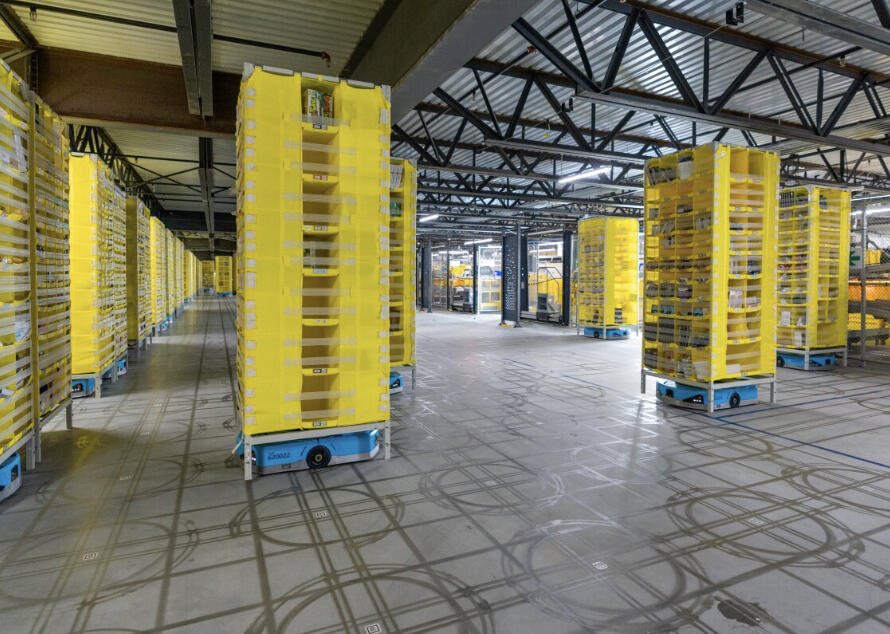 Amazon storage pods and mobile robots on a fulfilment floor
